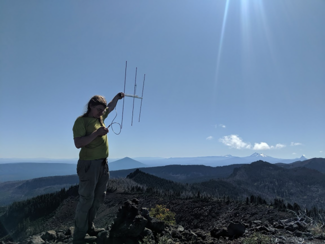 Image of me holding a yagi, courtesy of Will, KJ7FXU