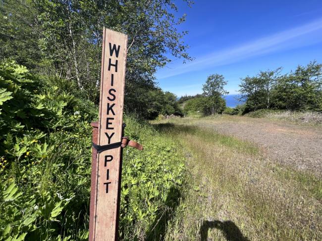 A signpost reads "Whiskey Pit"