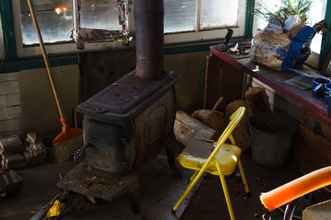 Tower inside with wood stove and chair