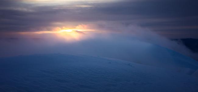 Wind and clouds along the crater rim