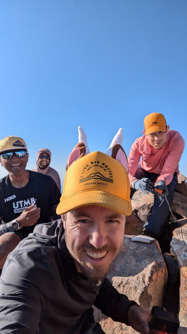 Group shot. Tim N7KOM has goat horns and ears on his hat.